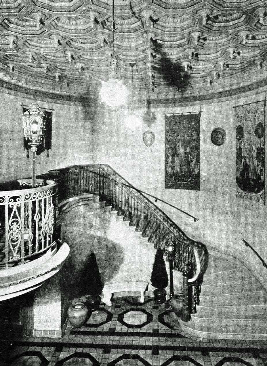 A staircase in a Spanish theatre, the Olympia, of Miami, Florida. Tile floor, with polychromed ceiling.
