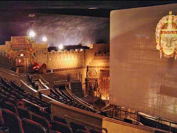 The theatre just prior to reopening in 2006, when it had a iWERKS “Extreme” screen which retracted into the flattened portion of the atmospheric ceiling. Note the Wurlitzer organ console at House Right.  Photo courtesy Mark Demmin II (JPG)