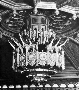 Promotional photo of the Fox Theatre featuring a kickline with accordionist in the central chandelier (JPG)