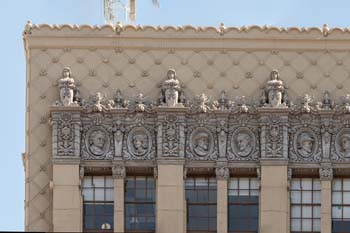El Capitan Theatre, Hollywood: Closeup of the east end of the horizontal frieze atop the theatre building’s façade which features 20 busts set within cast concrete medallions