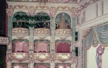 House Left boxes in 1985, prior to 1985 refurbishment, showing lighting instruments (Strand T/84 luminaires) and 1950s to 1985 auditorium colour scheme, from the RCAHMS Collection held by the Canmore Archive (JPG)