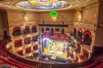 The King’s Crown, made of plaster and highlighted in green above the center of the proscenium arch