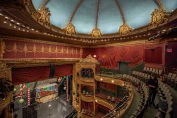 Auditorium of the New Victory Theater in New York, showing plaster cherubs around the auditorium ceiling dome