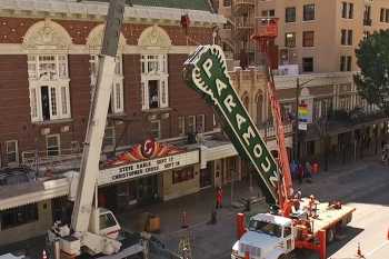 Installation of the Paramount’s replica vertical sign in 2015, ahead of the theatre’s centenary, courtesy <i>Paramount Theatre</i> (JPG)